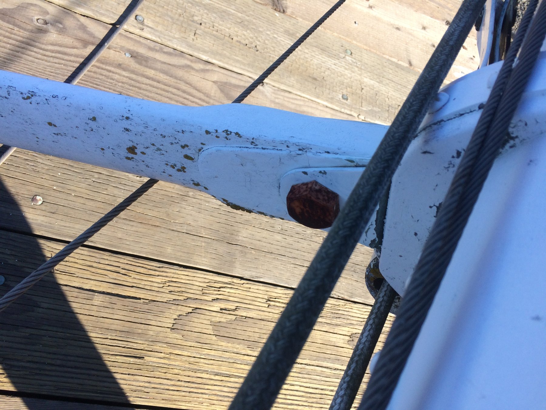 Weathered details of the classic 1946 Merry Maiden reveal her character and history—rust stains streak her blue hull while rope and wooden decking tell stories of decades on Puget Sound.