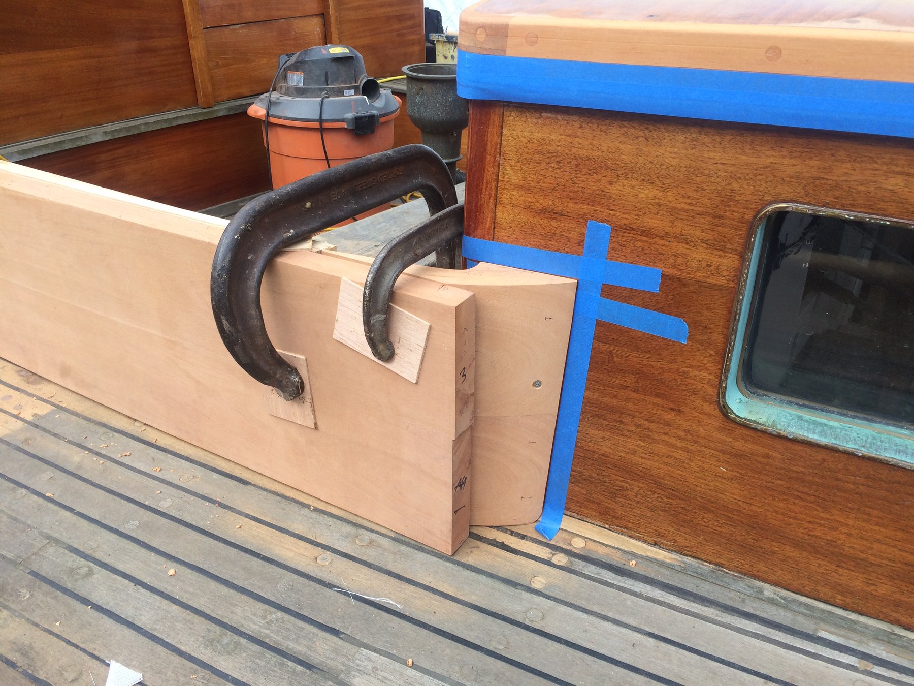 Merry Maiden's bow cleat receives protective boxing during restoration work, revealing the meticulous craftsmanship required to preserve this 1946 classic yacht.